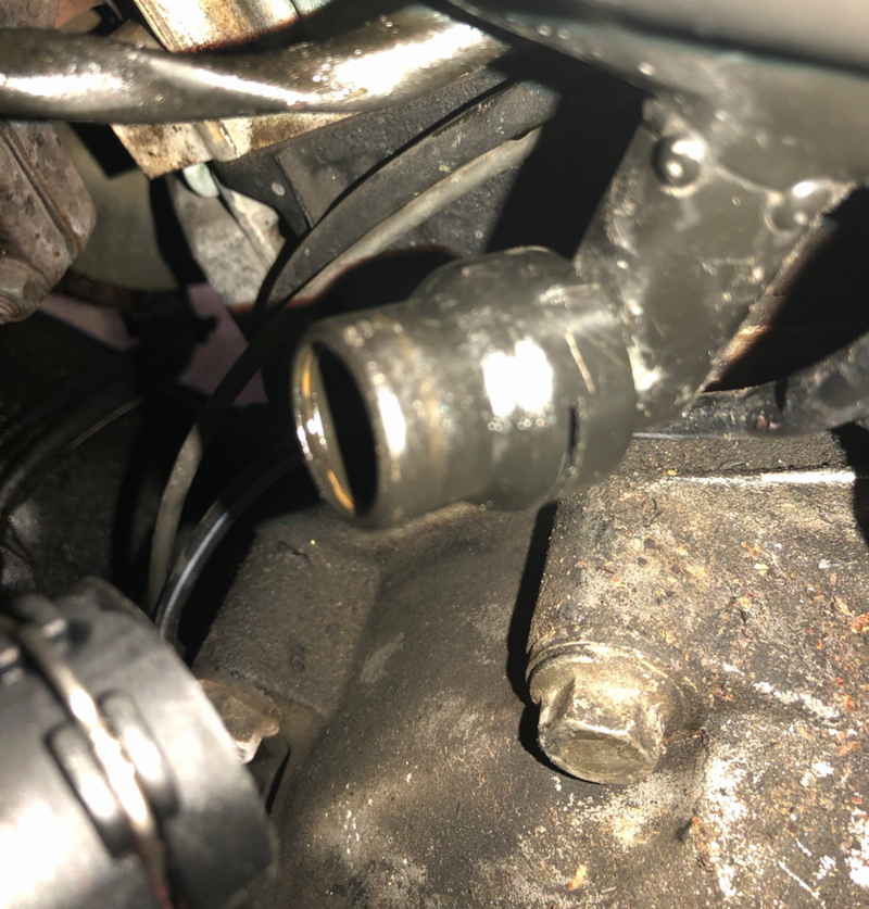That’s the connector and the hose bib. Sorry it’s out of focus but I was taking the picture with my phone dangling down behind the engine.